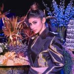 Mouni Roy dazzles in a stunning golden dress at Hyderabad fashion event.