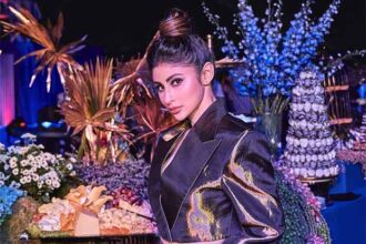 Mouni Roy dazzles in a stunning golden dress at Hyderabad fashion event.